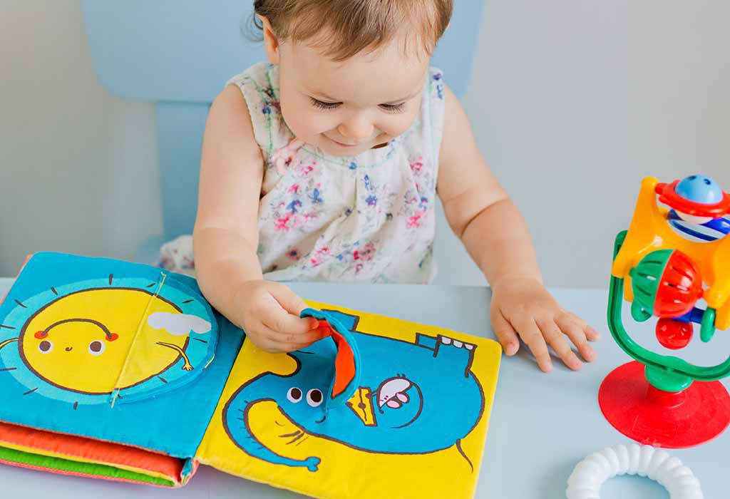 A child sitting cosily while reading a picture book